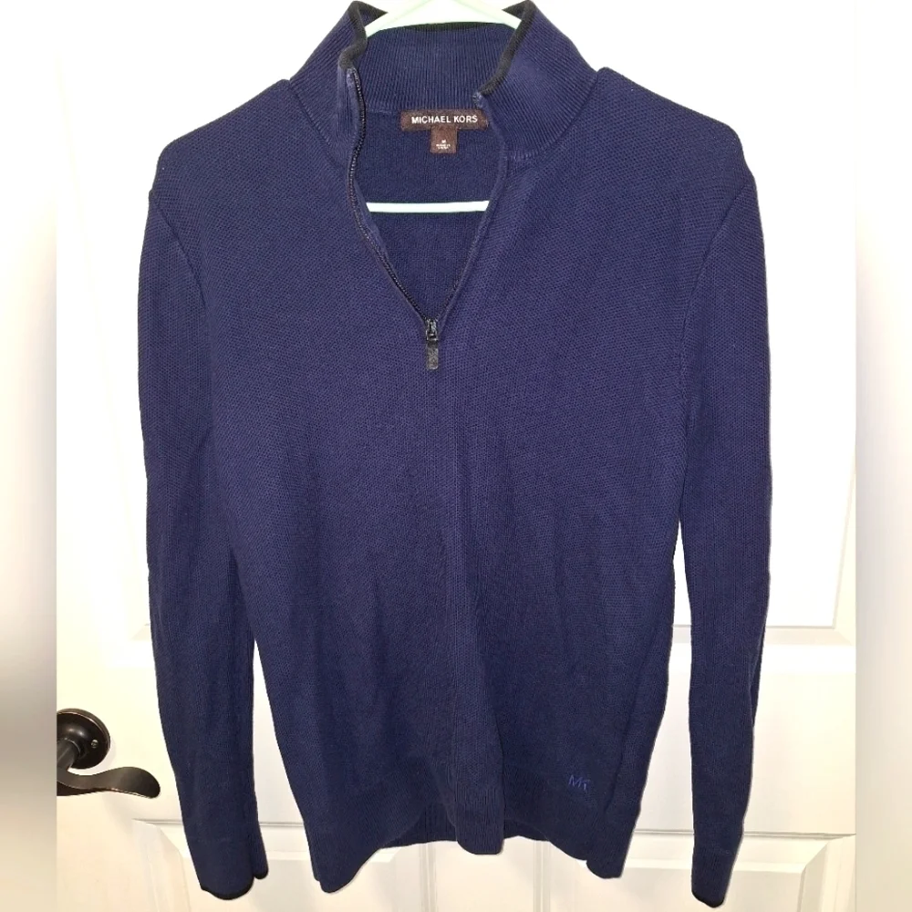 A Michael Kors men's 1/4 zip 100% cotton sweater in a size medium.